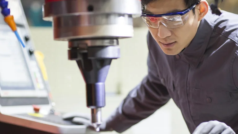 young engineer working in the factory