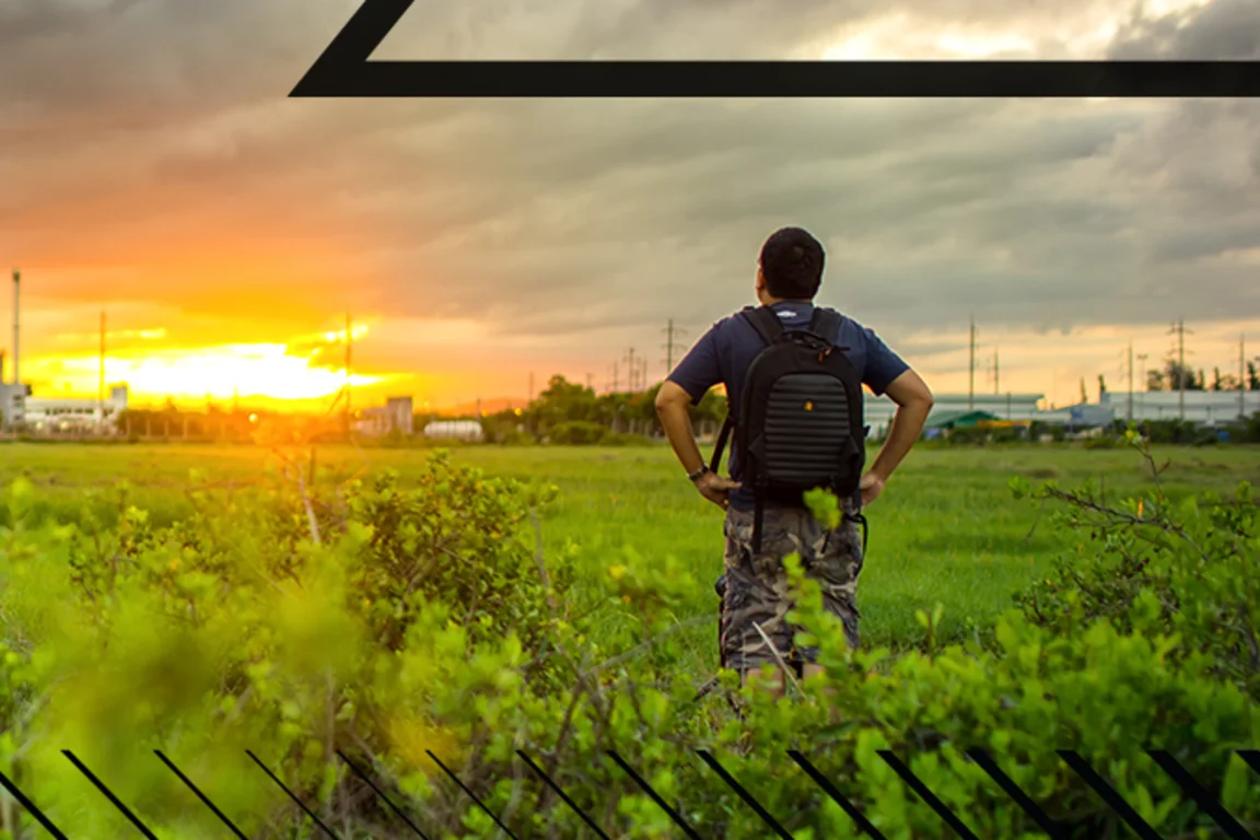 Man Standing in Front of Eco friendly Factory