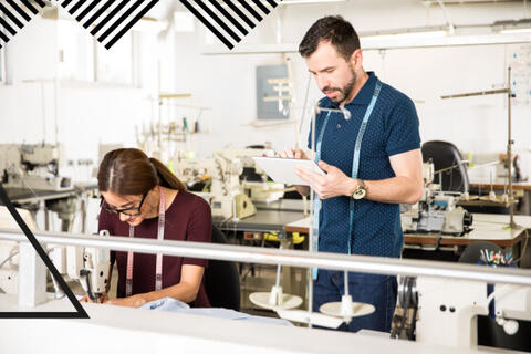 Two people working in a manufacturing setting